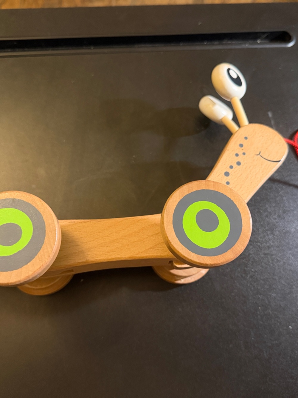 Wooden Pull-Along Snail Toy in Natural Wood and Green